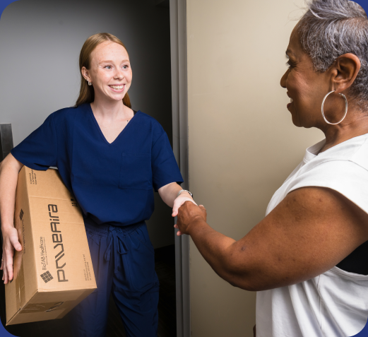 A BioTAB clinician delivering PnueAira equipment to a patient